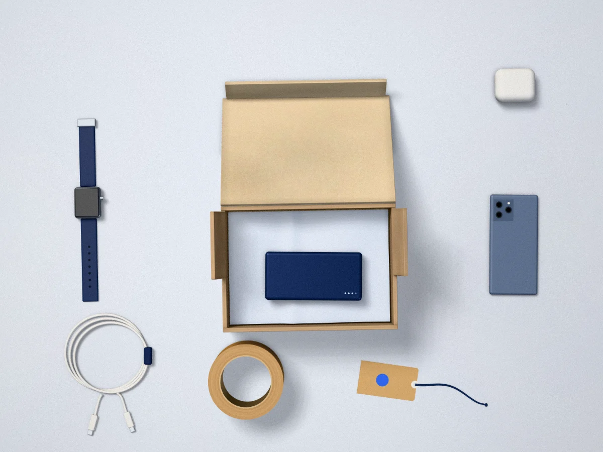 Mailer box, smartwatch, phone, cable and power bank on a sample table